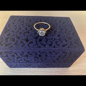 Yellow gold engagement ring in bezel setting
